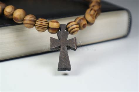 Christian Bible And Wooden Cross On A White Background Stock Image