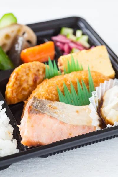 Traditional bento japanese cuisine — Stock Photo © Torsakarin #76414269