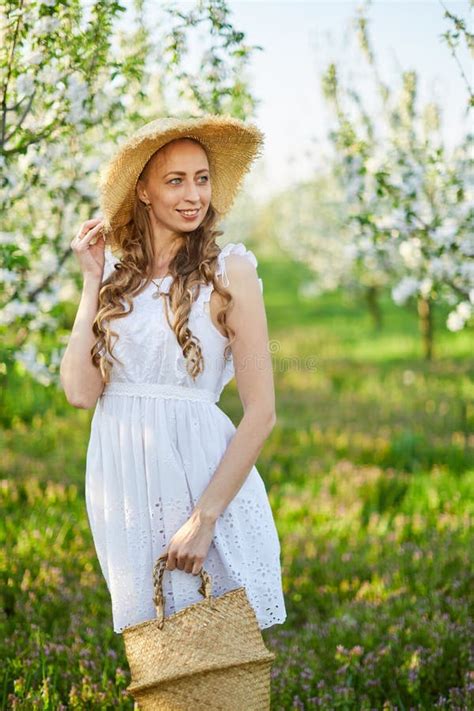 The Beautiful Girl The Blonde In The Blossoming Apple Trees Garden Stock Photo Image Of