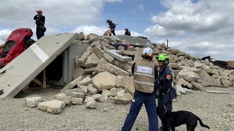 Urban Search And Rescue Responders Run Through Earthquake Drills With A