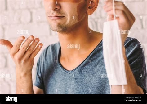 Portrait of young man patient with funny sun tanned lines on face after ...