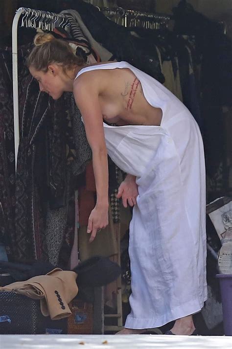 Amber Heard Suffers Multiple First Degree NIPSLIPs While Cleaning Out