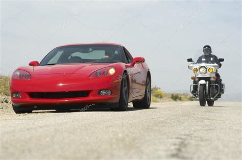 Traffic Cop Chasing Sports Car Stock Editorial Photo © Londondeposit