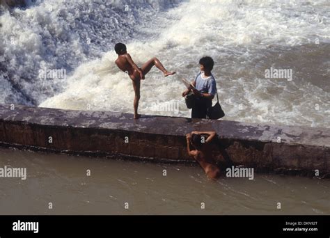 Boys And Teenagers Having Fun In A River In The Ancient Town Feng Stock