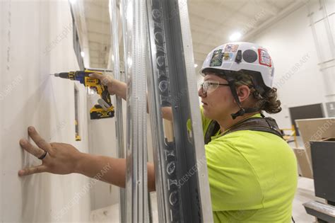 Apprentice carpenter using drill - Stock Image - C059/2246 - Science ...