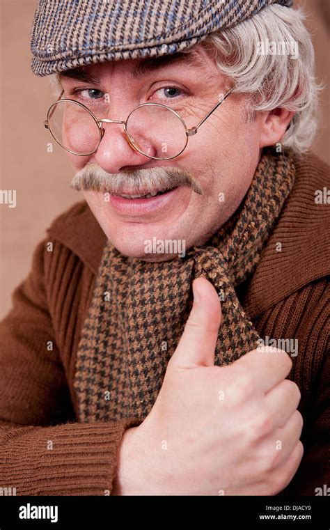 Grey Haired Old Man With A Big Smile And A Thumbs Up Towards Camera