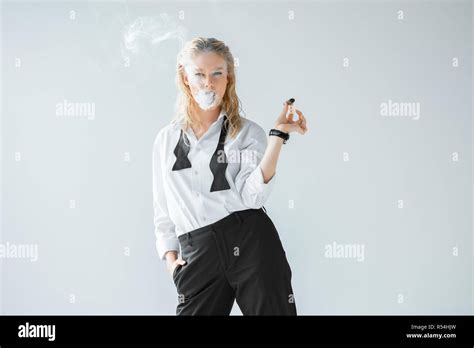 Attractive Stylish Blonde Girl Smoking Cigar Isolated On Grey Stock Photo Alamy