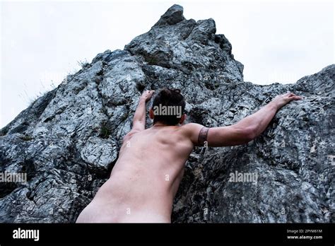 Man Climbing Naked On The Rock Stock Photo Alamy