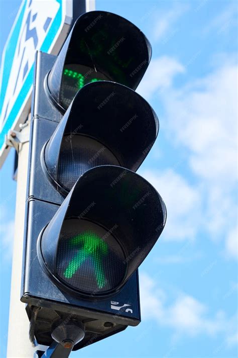 premium photo road green traffic light  pedestrians