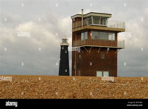 Abandoned Coastguard Station And Old Lighthouse At Dungeness Stock