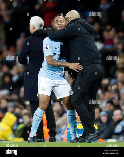 Manchester Citys Raheem Sterling With Manager Pep Guardiola During The Premier League Match At