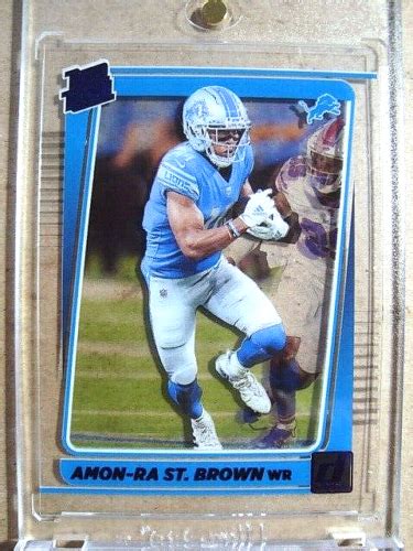 Amon Ra St Brown Clearly Donruss Rated Rookie Purple Rc Mint