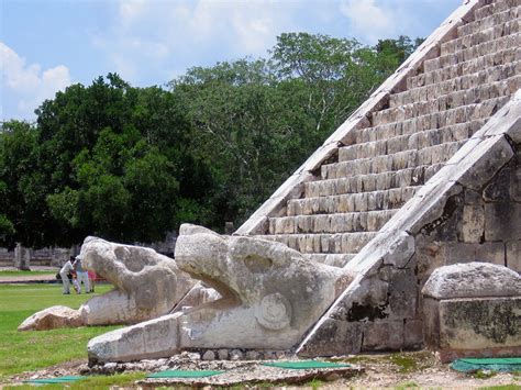 Snake Kukulkan Heads At The Bottom Of El Castillo Pyramid In Chichen