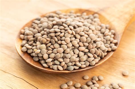 Premium Photo Lentil On Wooden Spoon On Table Lens Variabilis