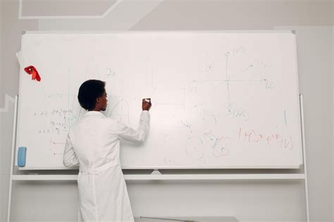 Premium Photo | African american woman math teacher stands at ...