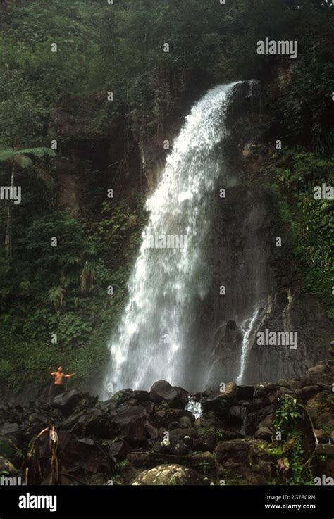 People Having A Recreational Time At Cibeureum Waterfall In Mount Gede