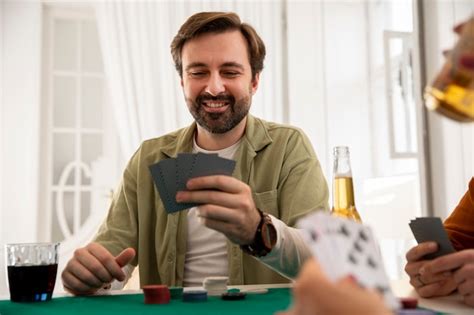 Free Photo | Close up on person playing poker with friends