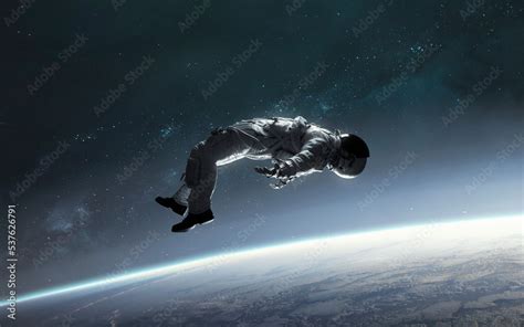 3D Illustration Of Astronaut Falling To Earth Planet 5K Realistic