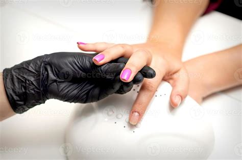 Finger with purple nail polish 21474212 Stock Photo at Vecteezy