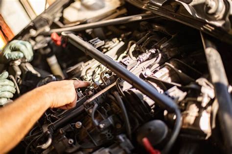 Premium Photo Mechanics Dirty Hands Repairing Car Engine