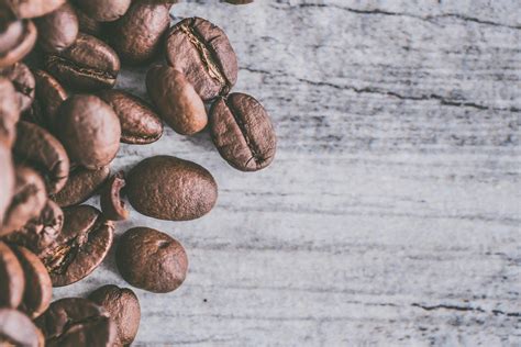 flat lay photography  coffee beans  wooden surface  stock photo