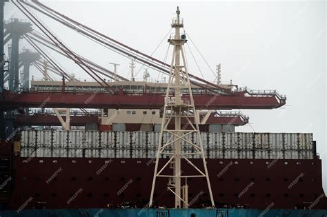 Premium Photo | Large container vessel during cargo loading operations ...