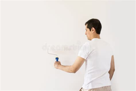 Painting the wall stock photo. Image of attractive, casual - 59542398