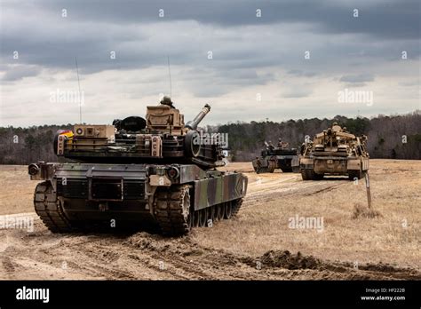 U S Marine Corps M1a1 Abrams Tanks And An M88 A2 Hercules Recovery