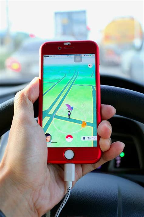 Pokemon GO : Driver Play Pokemon Go on the Car during Driving Editorial Image - Image of ...