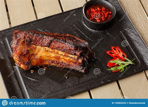 Grilled And Barbecue Hot Pork Ribs With Hot Chilli Pepper And Hot Sauce