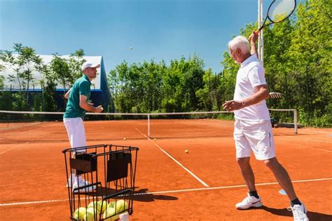 Senior Man Playing Tennis Stock Photo By Microgen 115174248