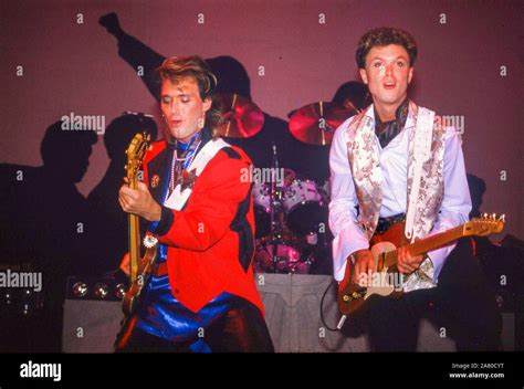 Spandau Ballet on stage in London 1985:Martin Kemp,left and Gary Kemp Stock Photo - Alamy