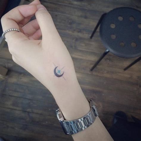 Small Moon And Star Tattoo On The Hand