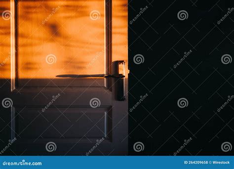 Vintage Door Under The Golden Sunlight Shining Through The Window In