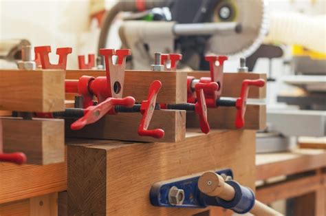 Premium Photo | Red joiner39s clamps are fixed on product gluing of ...