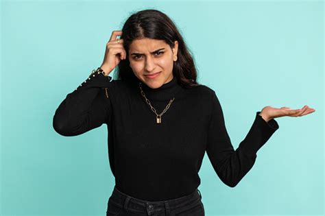 Puzzled Clueless Uncertain Woman Raising Hands In Helpless Embarrassed ... 