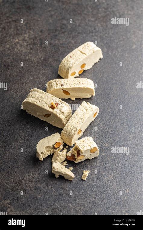 Sweet Tahini Halva With Almonds Turkish Dessert On A Kitchen Table