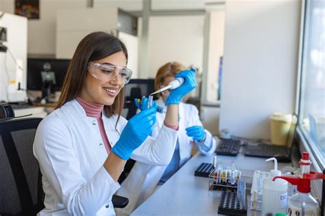 Premium Photo Female Medical Research Scientist Looks At Biological