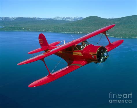 Beechcraft Model 17 Staggerwing Flying Photograph by Phil Wallick