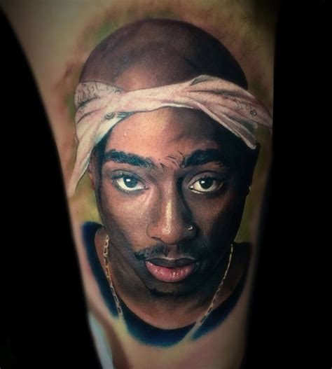 Realistic Tupac Portrait On Bicep | Best tattoo design ideas