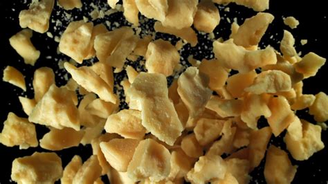 Parmesan Cheese Flies Up And Falls Down Filmed On A High Speed Camera