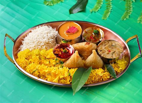 Premium Photo Onam Feast Eating Onasadya In Banana Leaf During The