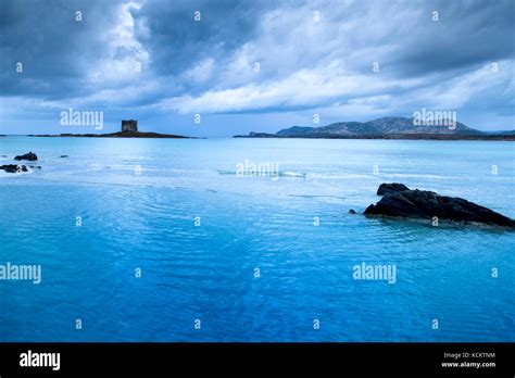 A View Of The Spiaggia Della Pelosa Beach In Sardinia Italy With The