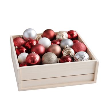 Wooden Box Filled With Christmas Decorations On Color Wooden Table