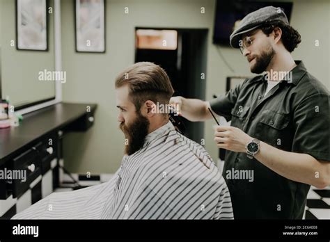 Portrait Of Attractive Young Man Getting Trendy Haircut Male