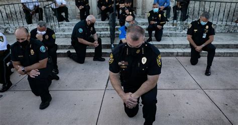 Police officers kneel in solidarity with protesters in several U.S ...