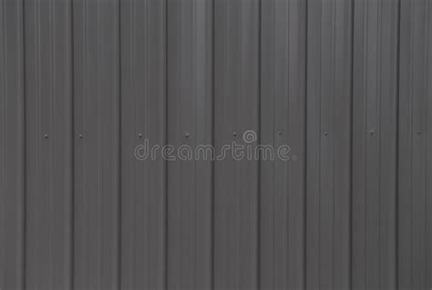 Background Of Dark Brown Metal Siding On A Building Stock Photo Image