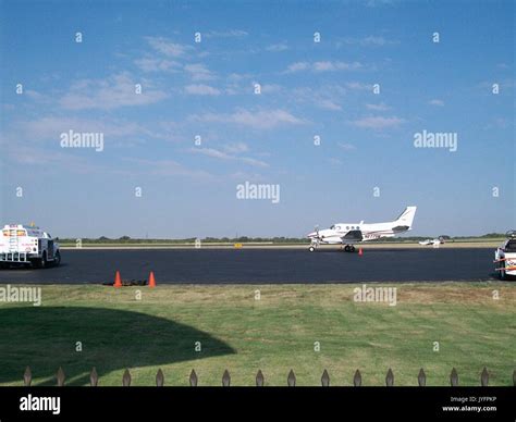 A Plane Landing At Denton Municipal Airport Stock Photo Alamy