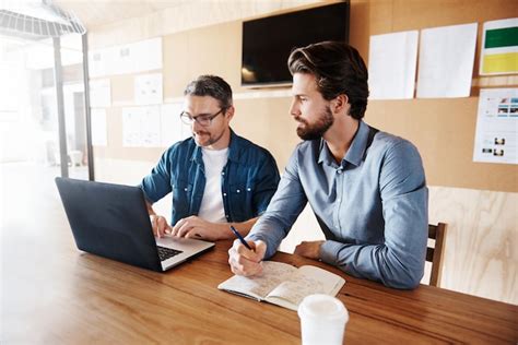 Premium Photo Businessmen Having Discussion At Office