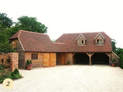 A Large Wooden Building With Two Garages On Each Side